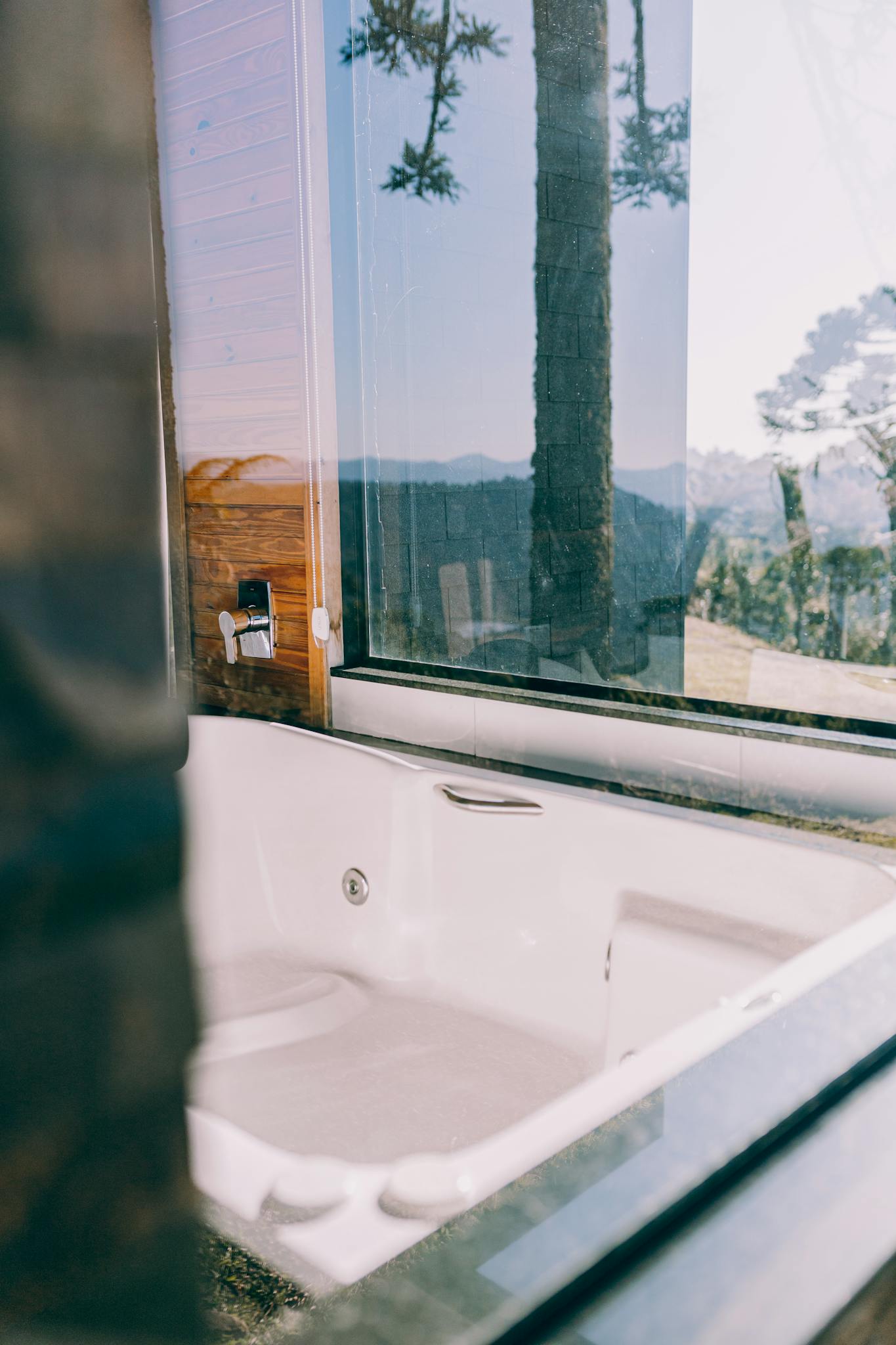 Experience serenity with this luxury bathtub overlooking breathtaking mountain scenery.